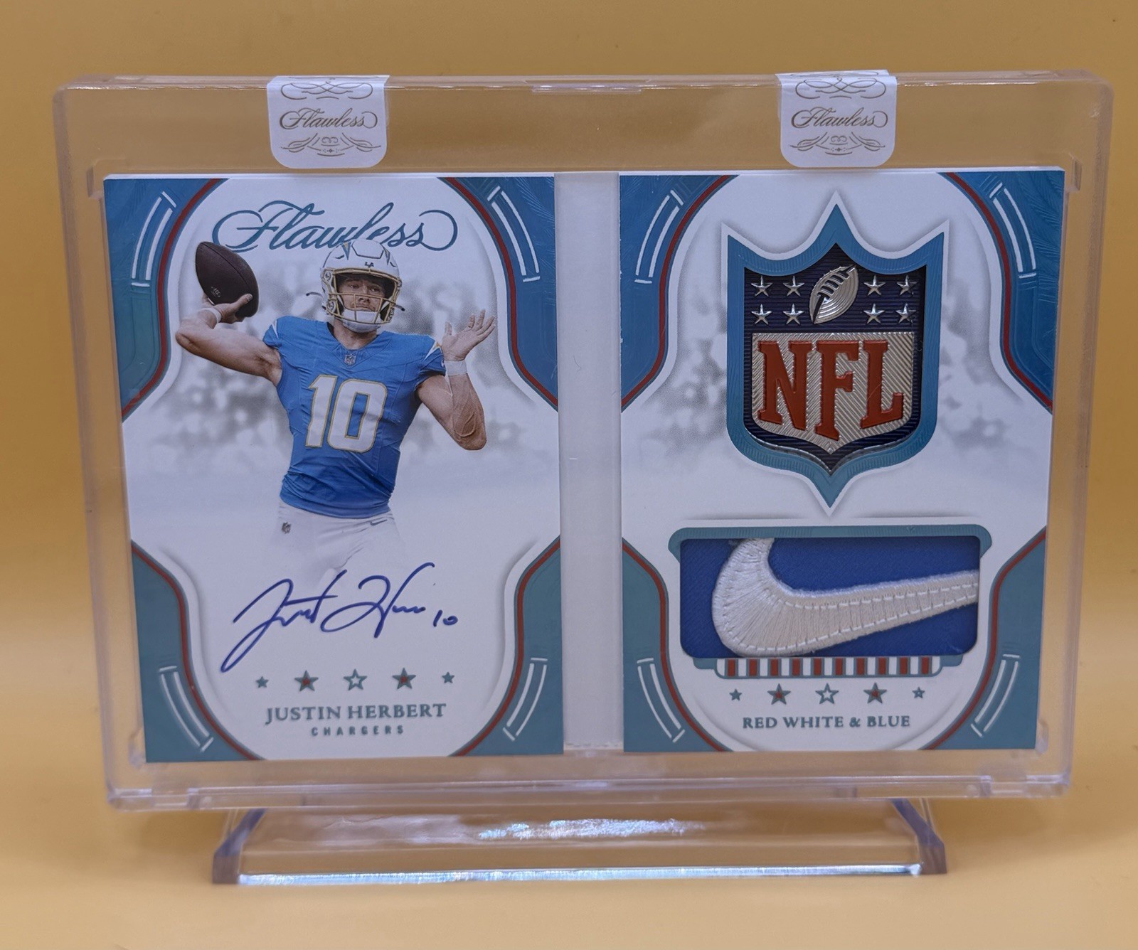 2025 Flawless 1/1 Autographed Booklet card- Shield and Swoosh.