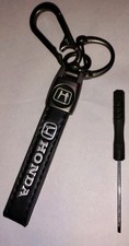 A Black And Chrome Honda Genuine Leather Keyc...