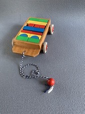 Vintage Holzspielzeug Nachziehwagen und Bausteine Made in West Germany Heros