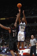 Guard Ray Allen Milwaukee Bucks shoots over guard Raja Bell Phila- 2002 Photo