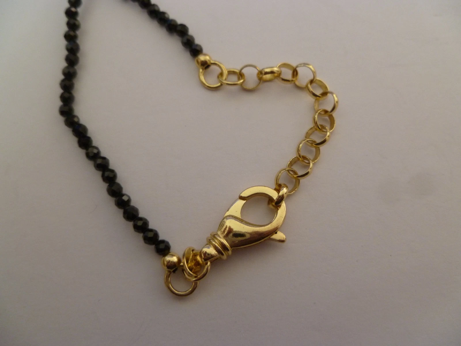 Bellezza Black Spinel Gold Tone, Black Openwork Floral Heart Pendant Necklace - product detail image 4