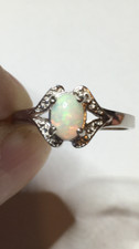  131B- .65ct Genuine Ethiopian Welo Opal set in a Size 9 Sterling Silver Ring