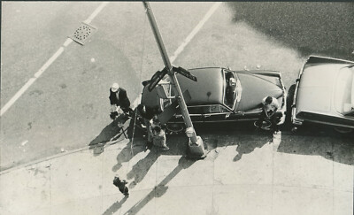 LOOKING DOWN ON PHOTOGRAPHER TAKING PHOTO AT SOUTHERN BLVD AT 163 ST,BRONX, N.Y.
