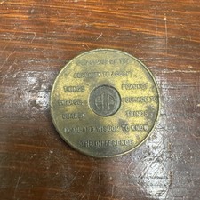 Moneta AA vintage in ottone