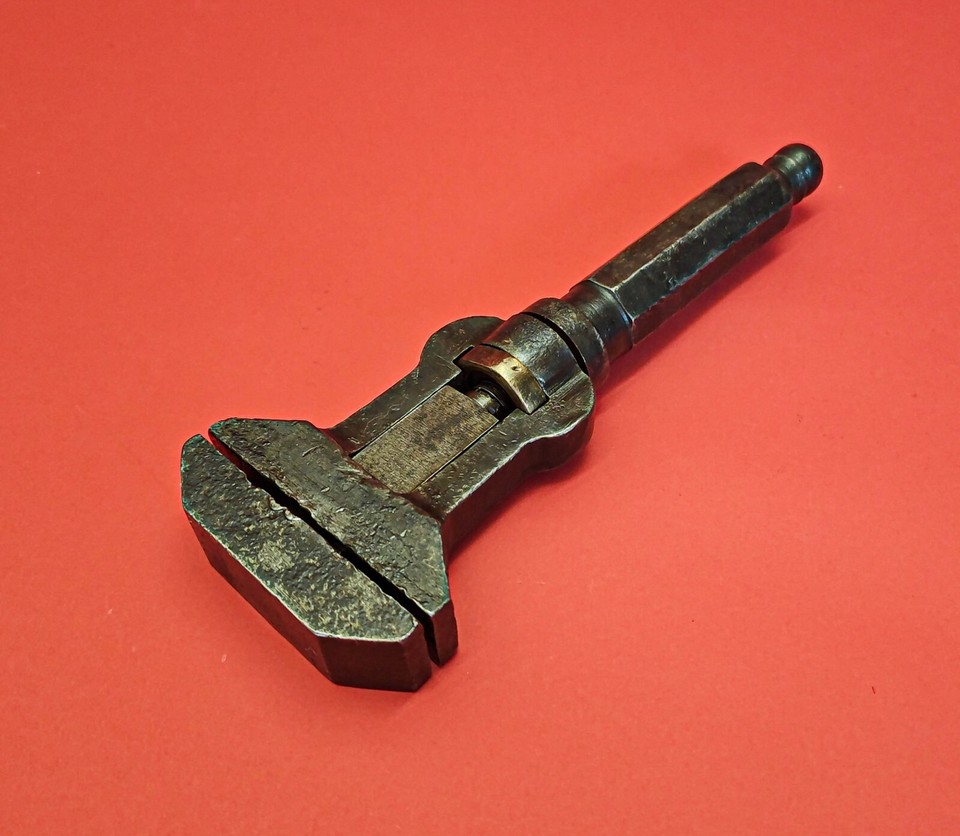 A rare adjustable buggy wrench that also functions as a screwdriver — an ingenious antique multi-tool from the horse-and-carriage era that feels like a steampunk prop.