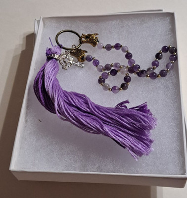 Amethyst style prayer beads with a nice purple tassel and small cross