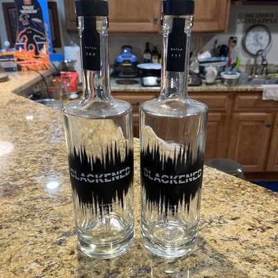 TWO (2) BLACKENED (empty)  Whiskey BOTTLES METALLICA BATCHES 089 and 111 NICE! 