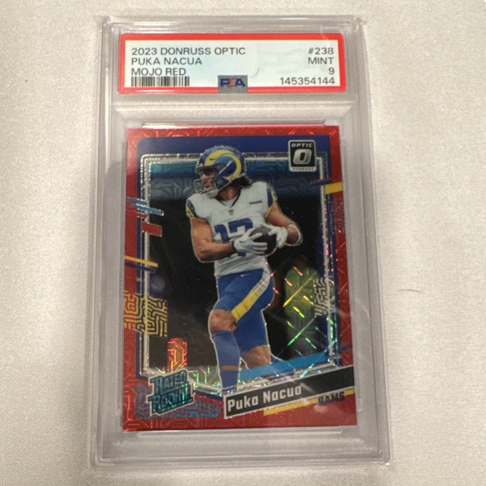 2023 Panini Donruss Optic Rated Rookie Puka Nacua Rams Red Mojo Prizm #238 PSA 9