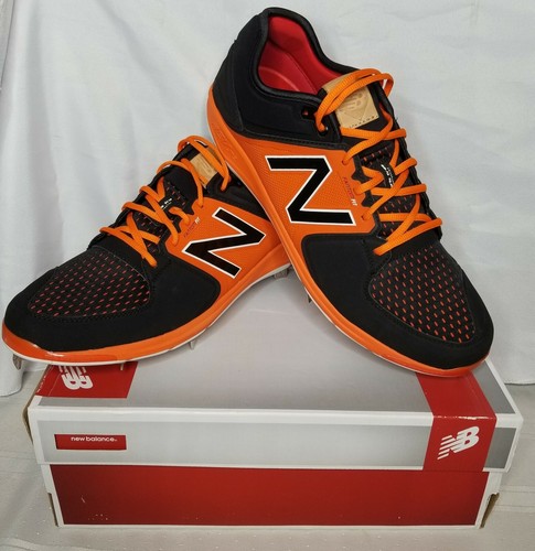 new balance black and orange baseball cleats