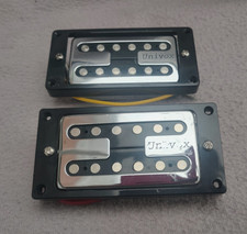 pair of Univox humbucker guitar pick ups with 'H' tops
