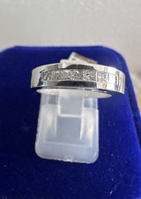 14kt.white gold wedding band with princess cut diamonds, size 6,- 4.8grams.