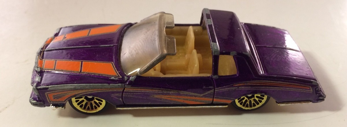 Hot Wheels 2001 Purple / Orange Stripe Montezooma GMTM 1:64