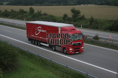 Truck photo MAN TGX Tarpaulin trailer Hungary red NYÍRSÉG TRANS KFT. #c4qp