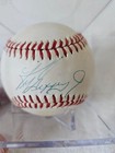 Ken Griffey Jr. Autographed Baseball and Card in case. PSA/DNA Authentication
