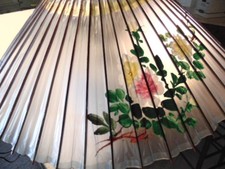 Older transluscent plastic or celluloid Asian parasol with painted flowers