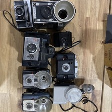 Vintage camera lot with Kodak, Polaroid, and flash cameras, great for display.