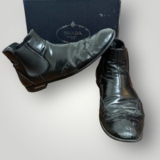 Prada Men's Black Leather Wingtip Chelsea Boots Metal Logo Heel Ankle 11 or 44