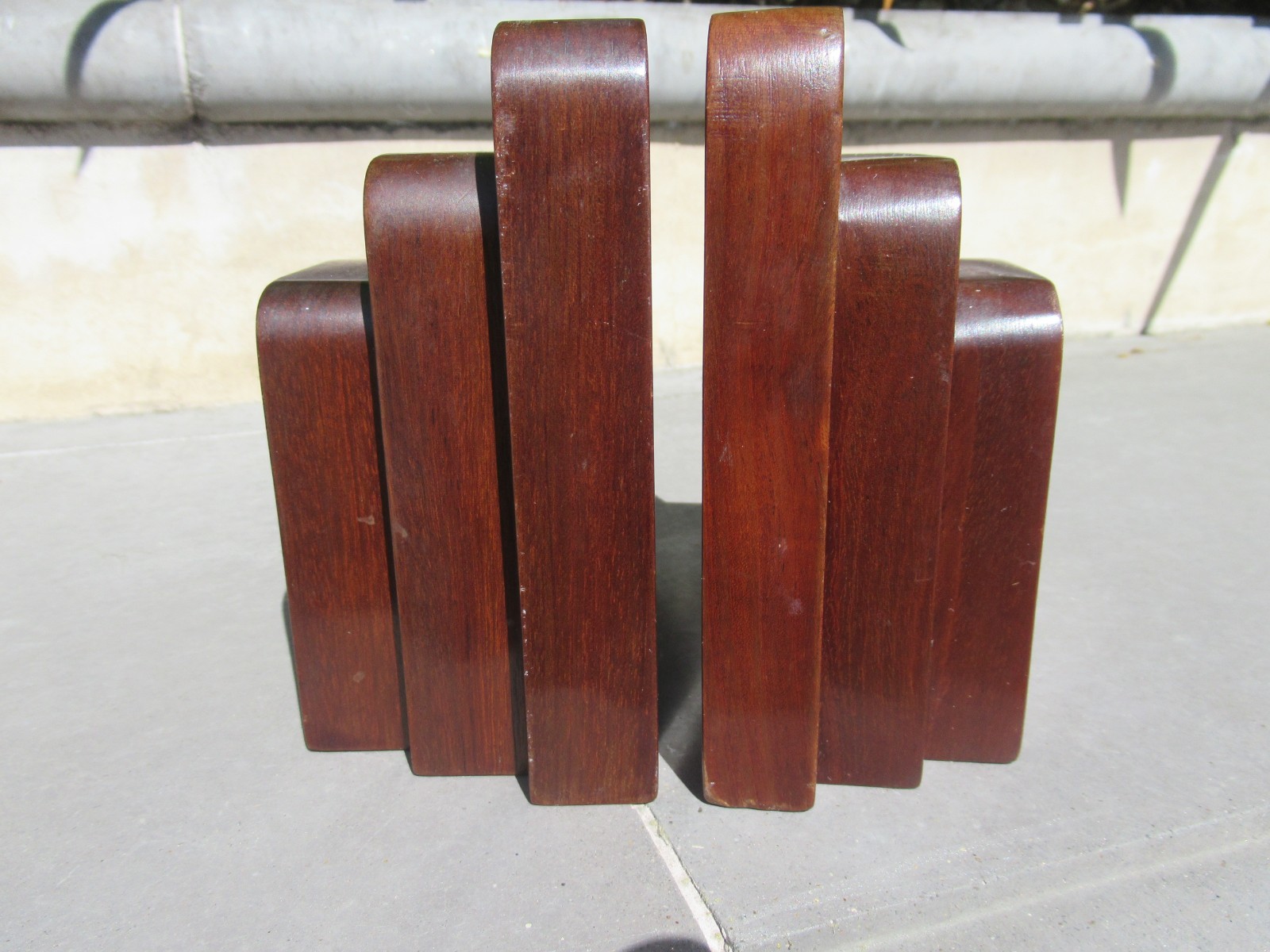 Pair of solid mahogany carved MCM wood bookends