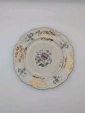 antique porcelain plate featuring hand-painted floral motifs and gilded accents