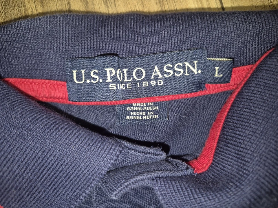 US Polo Assn. Camisa polo de golf de manga corta para hombre talla grande azul oscuro Foto 2 de 4