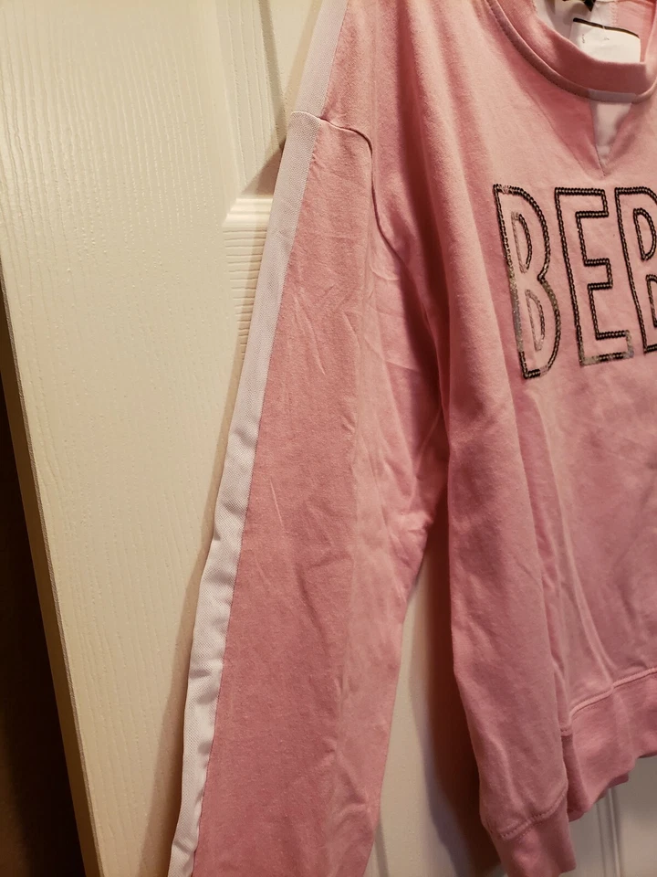 Top deportivo Bebe grande PEONY L manga blanca transparente a rayas en el brazo lentejuelas plateado $49 Foto 2 de 4