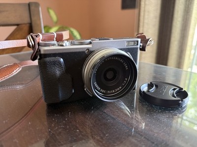 Fuji x70 Silver w/charger, strap extra battery.