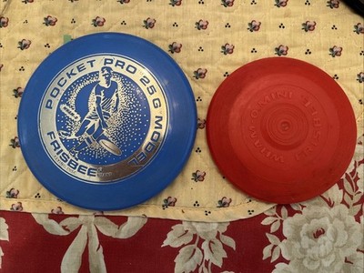 Pocket Pro Model 25G Mini Frisbee & Red Wham-o Mini Frisbee.