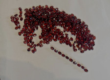 TEN PIECES OF 10 7X5MM OVAL FACETED GARNETS BELOW WHOLESALE  