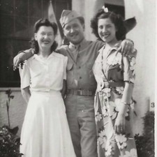 Vintage Snapshot Photo 1940s WWII Era Man In Uniform Poses With Two Women 1943