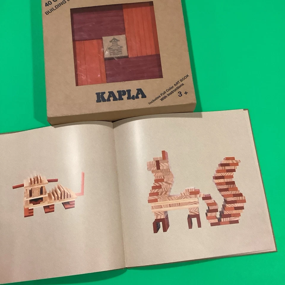 Bloques Kapla - Kit de construcción con libro de ideas Tablones rojos anaranjados en excelente estado Foto 3 de 4