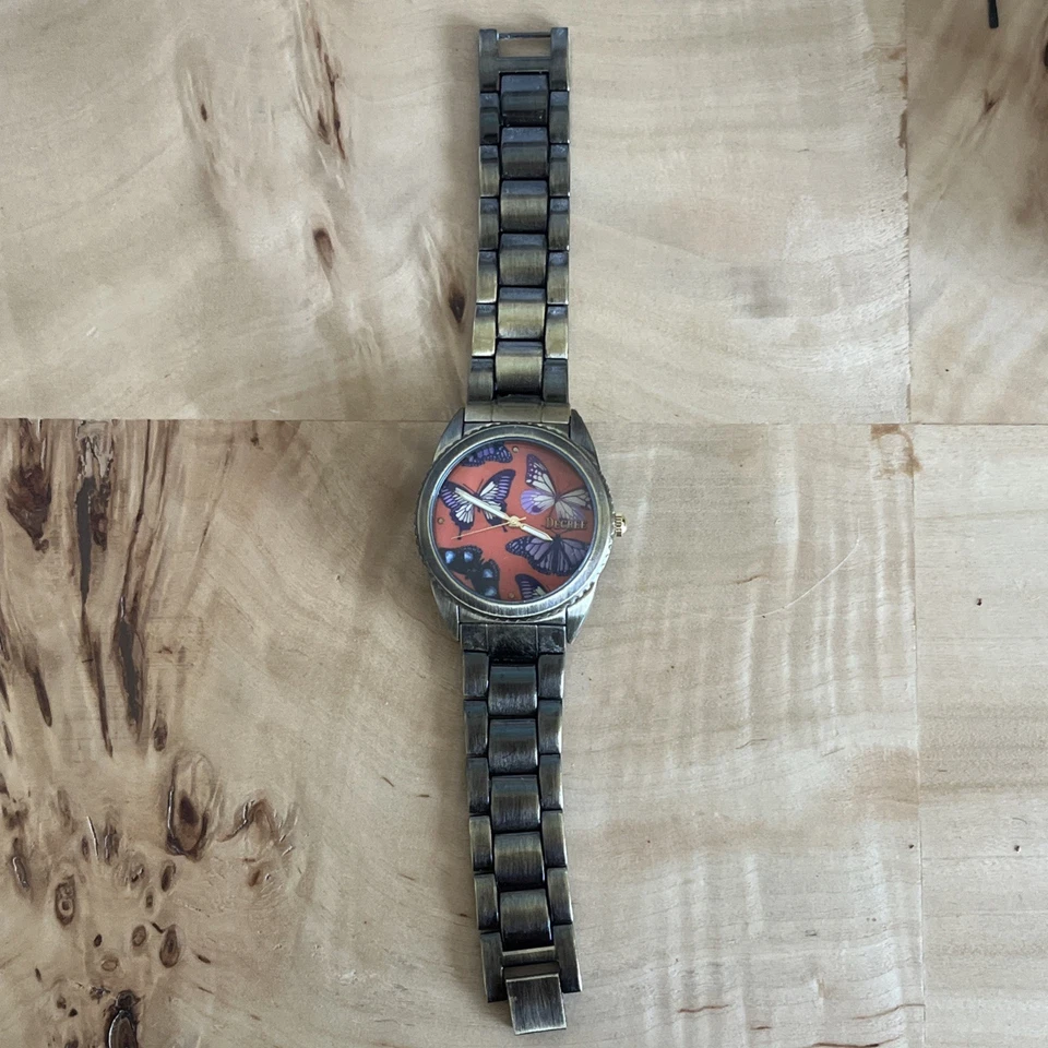 Reloj pulsera Decree esfera mariposa tono bronce eslabón trasero acero inoxidable  Foto 2 de 4