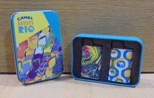 CAMEL CIGARETTES SET OF TWO PLASTIC LIGHTERS ARTISTS RIO SERIES IN TIN BOX