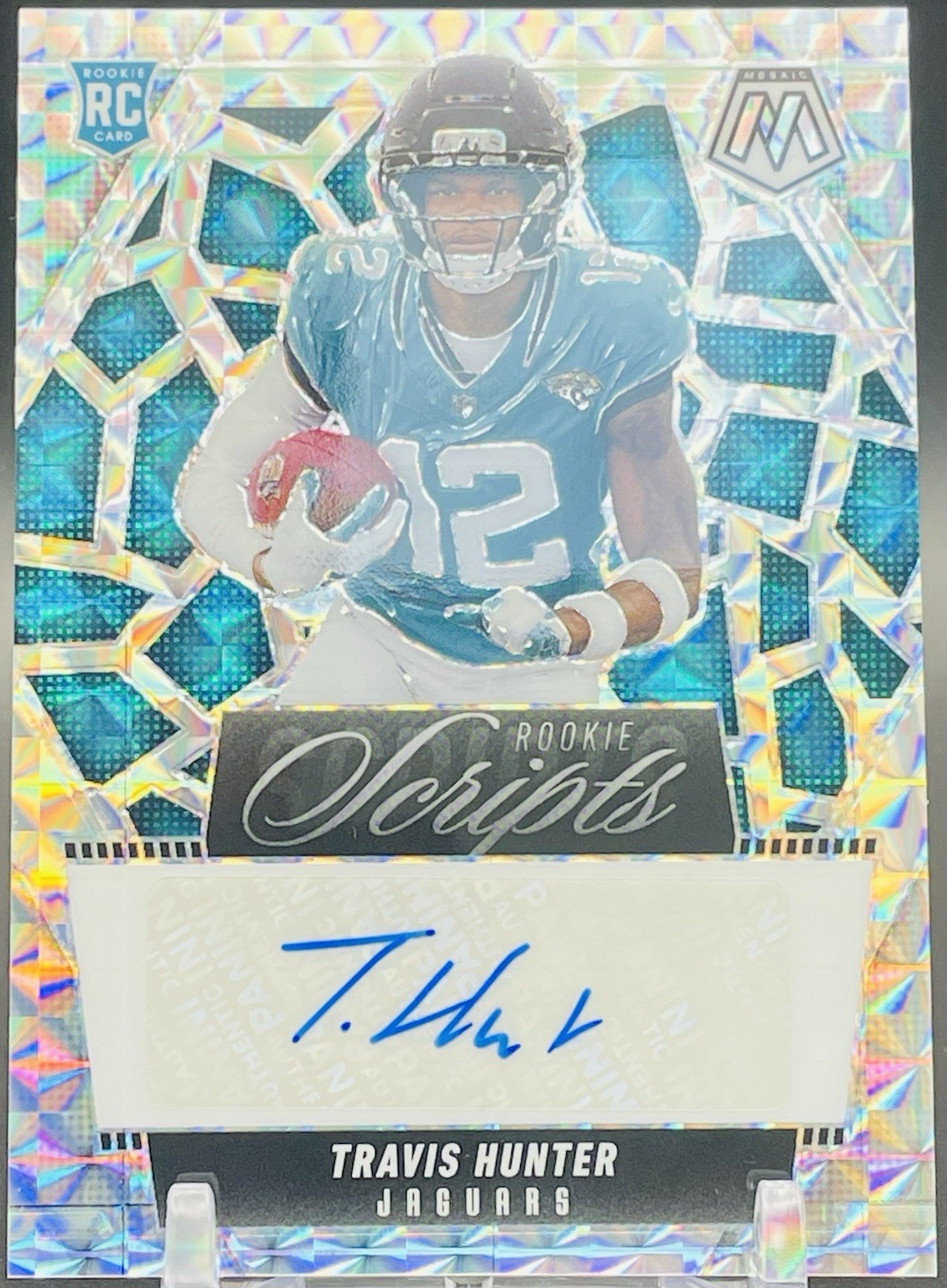 2025 Panini Mosaic-Rookie Scripts Mosaic Prizm #RS-THR Travis Hunter (AU,RC)