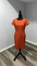 Women’s size 6 orange sheath dress With Gold Metal Decor Tahari Arthur Levine