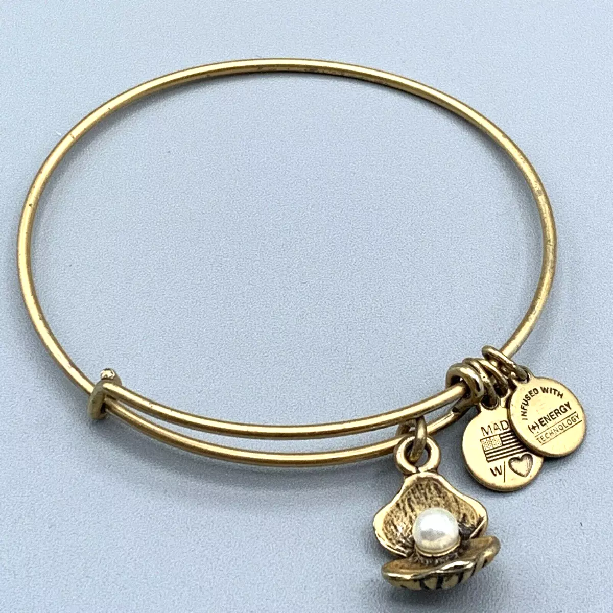 Alex and Ani Gold Tone Bracelet With a Clam and Pearl Charm A118