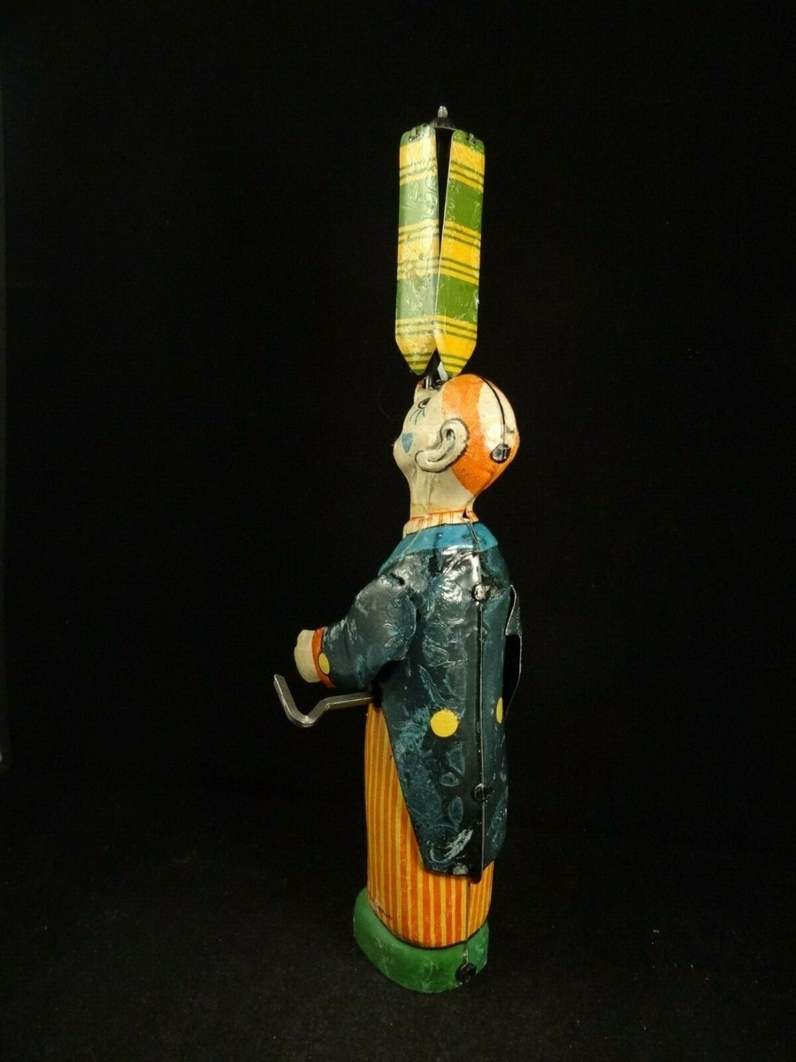 MIC, France - H. 20 cm - Clown mécanique en tole, années 50