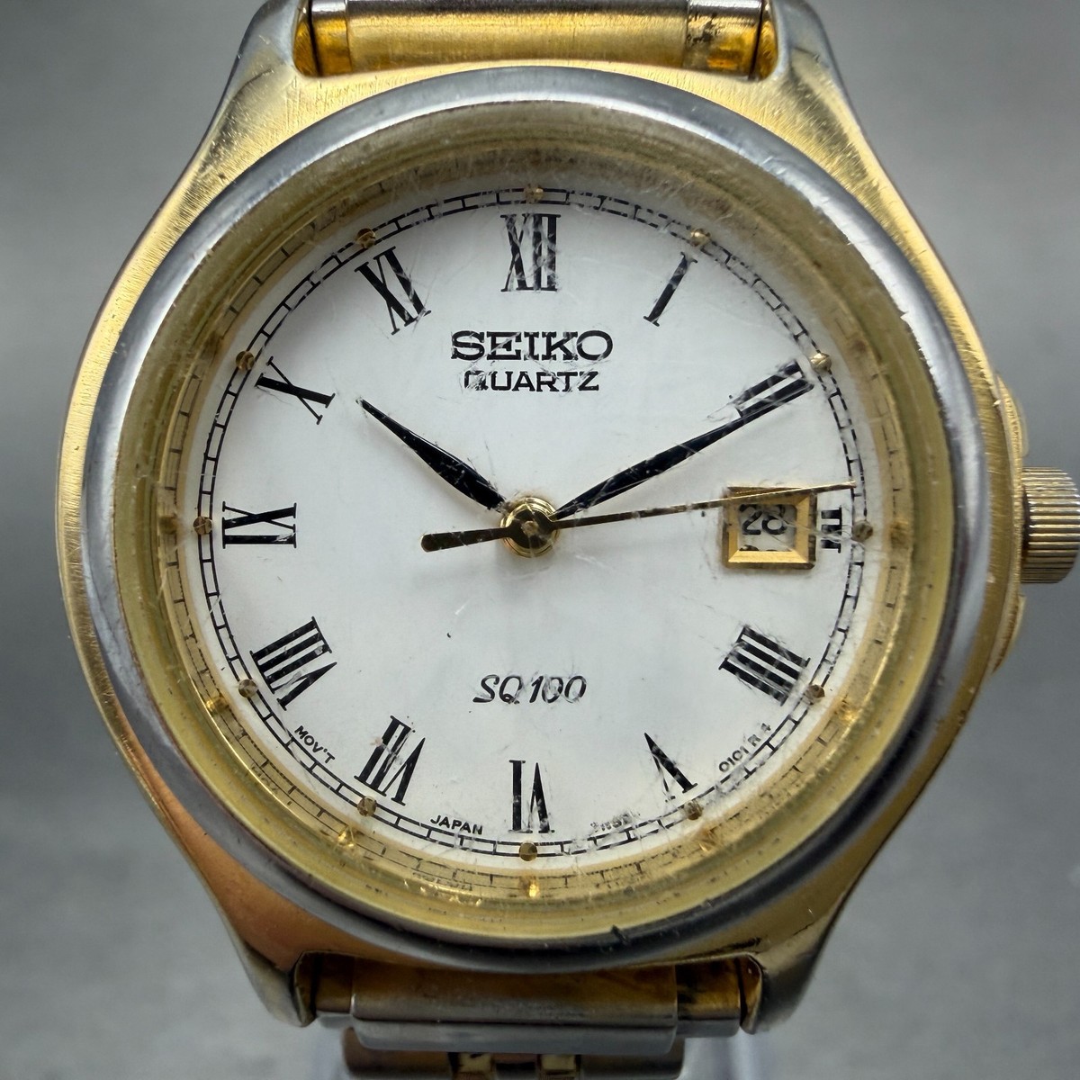 Seiko SQ 100 Watch Women 28mm White Dial Gold Tone Date 7N82-0061