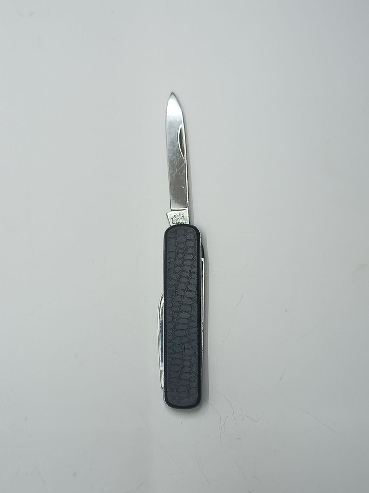 A Solingen-made black textured multi-tool folder — from the city synonymous with blade-making, this is a sleek, no-nonsense German EDC with heritage.
