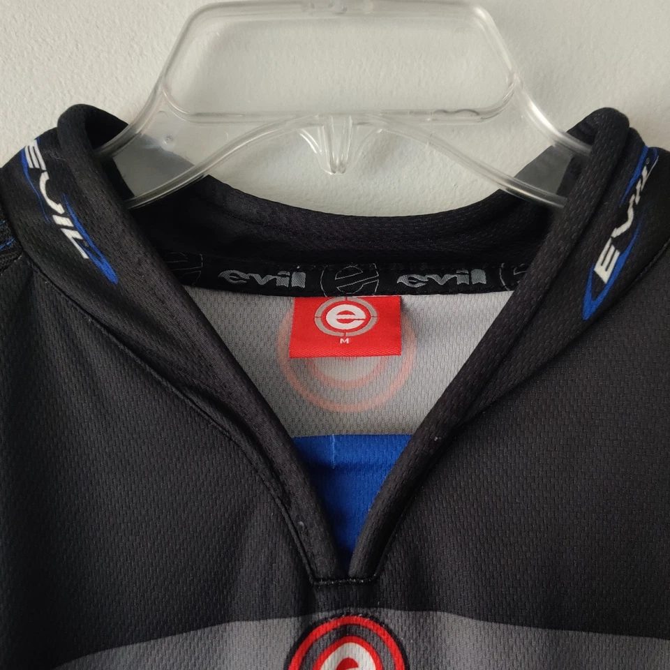 Camiseta deportiva de paintball EVIL acolchada manga corta con bolsa frontal azul negro gris Foto 3 de 4