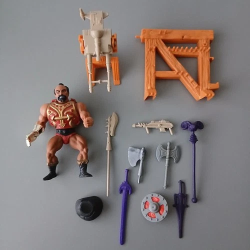 Vintage MOTU He-Man figure and Castle Greyskull parts lot.