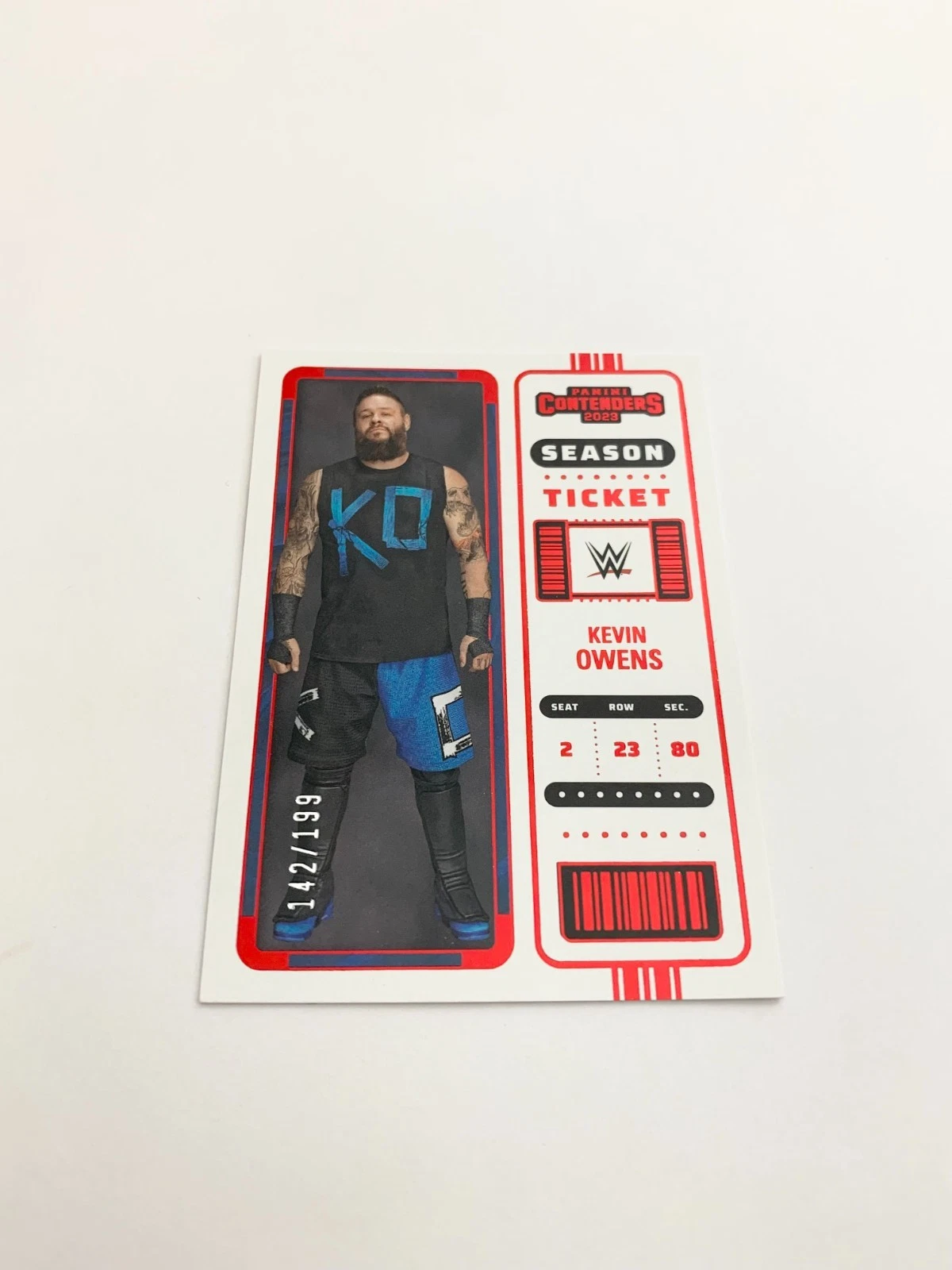 Kevin Owens Season Ticket Red 142/199 2023 Panini Chronicles WWE Card # 108