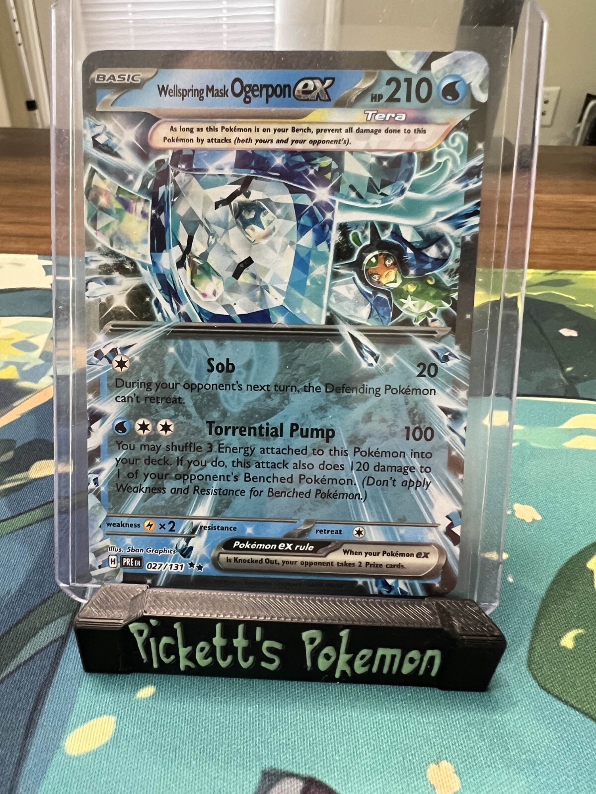 Wellspring Mask Ogerpon ex 027/131 Sv: Prismatic Evolutions Holo NM/Pack Fresh