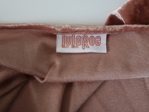 Rose gold pink velvet cover up jacket with white tag reading “LuLaRoe” in red cursive text on inner collar.