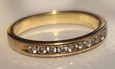 Anello KWIAT in oro giallo 18 kt con diamanti bianchi tondi a fascia 1/4CTW misura 6,25