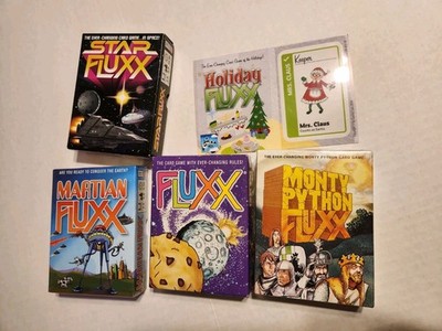 Lot of 4 Fluxx games Fluxx, Star Fluxx, Monty Python Fluxx, Martian Fluxx + card