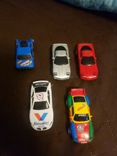 LOT OF 5 SLOT CARS 1998 CAMARO, 2 1997 CORVETTES, PONTIAC, AND BLUE RACE TRUCK.
