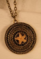 Lovely Filigree Swirled Rim Delightful Raised Starfish Brasstn Pendant Necklace