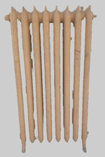 Radiateur ancien sur pieds a huit lames fleuries en fonte de fer XX siècle