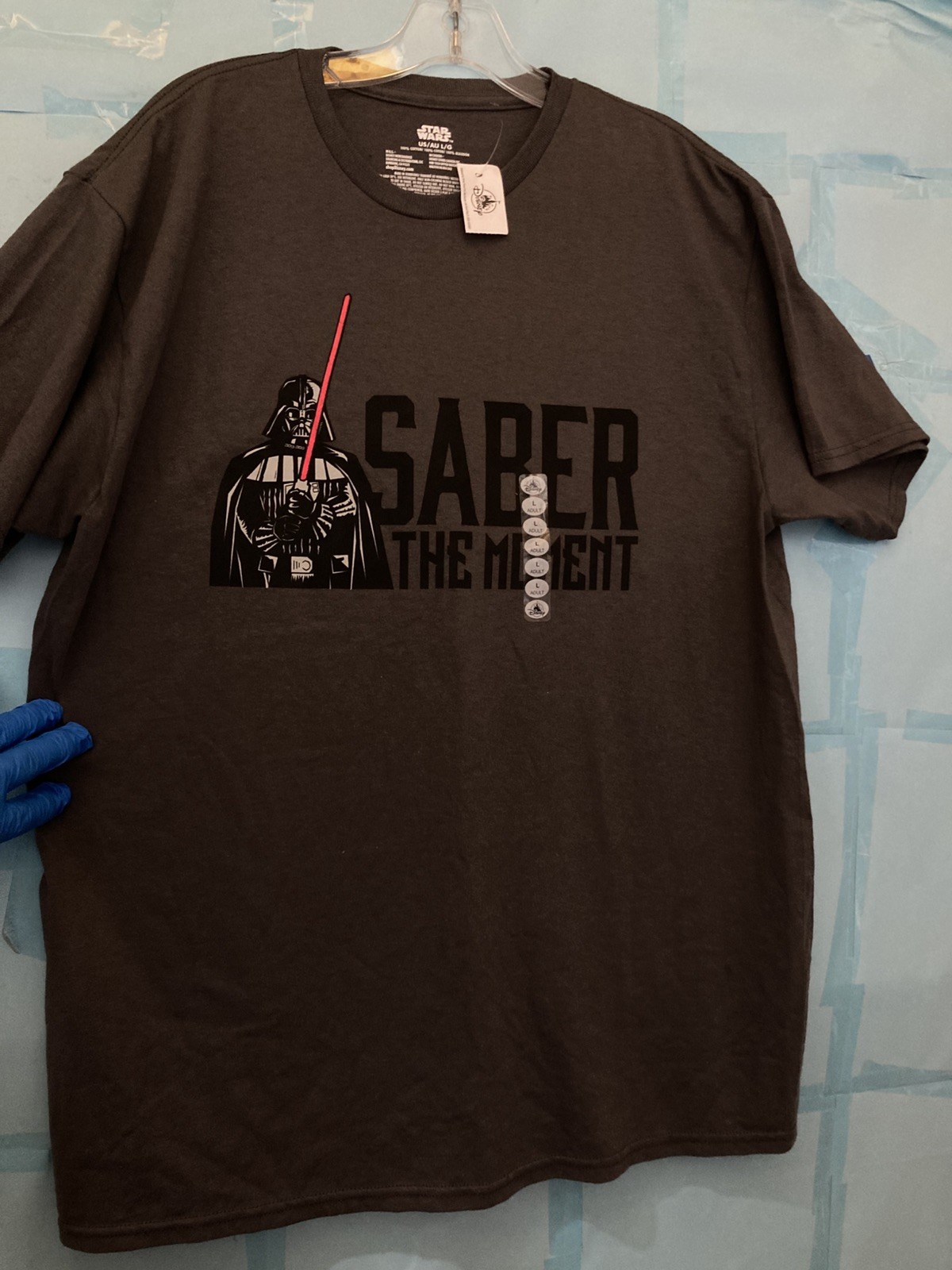 [NEW] DISNEY STAR WARS “SABER THE MOMENT “ Unisex T Shirt; LARGE; New With Tag