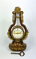 Manteluhr-French Ormolu-Lyre-Nuss Holz-19. Jhd-Huvelliez &agrave; Versailles-Art. 6765